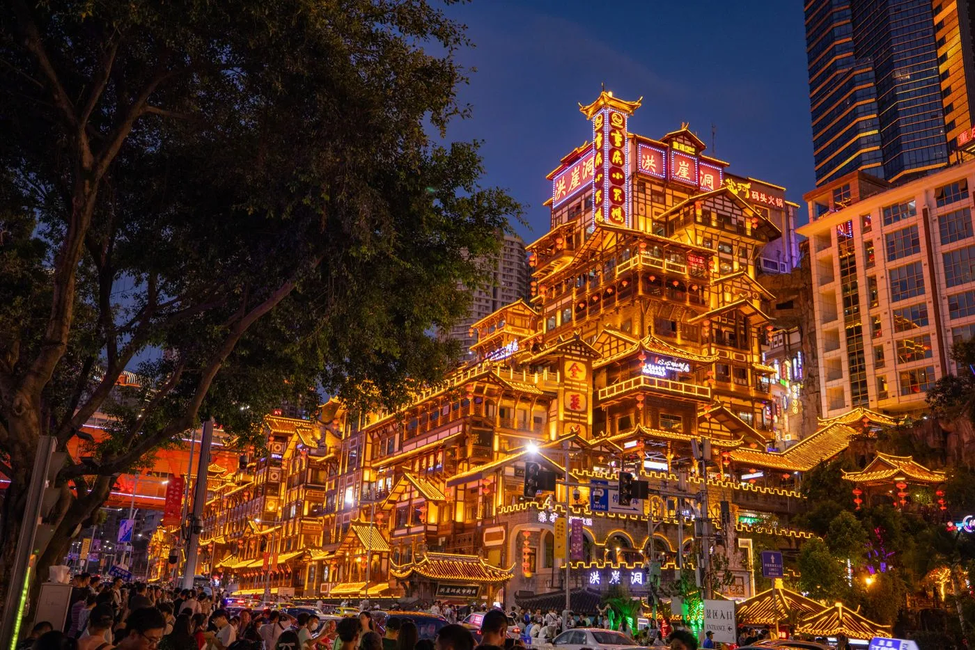 The stacked riverside buildings of Hongyadong illuminated at night in Chongqing