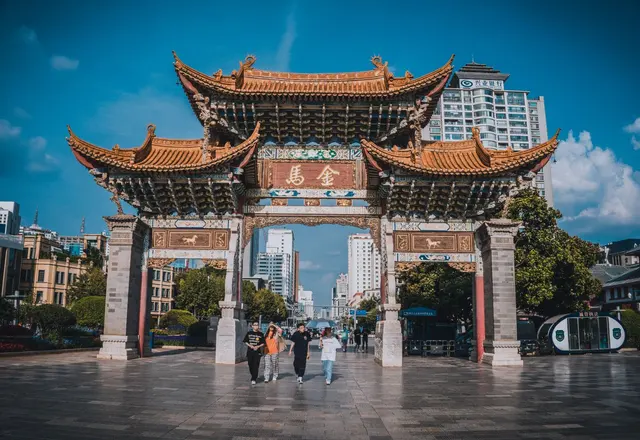 The traditional Biji archway in Kunming with its ornate tiled roofs and Chinese sign