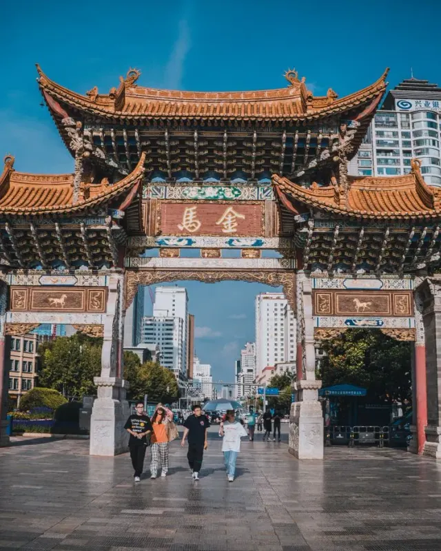 The traditional Biji archway in Kunming with its ornate tiled roofs and Chinese sign
