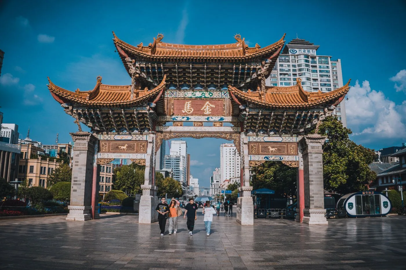 The traditional Biji archway in Kunming with its ornate tiled roofs and Chinese sign