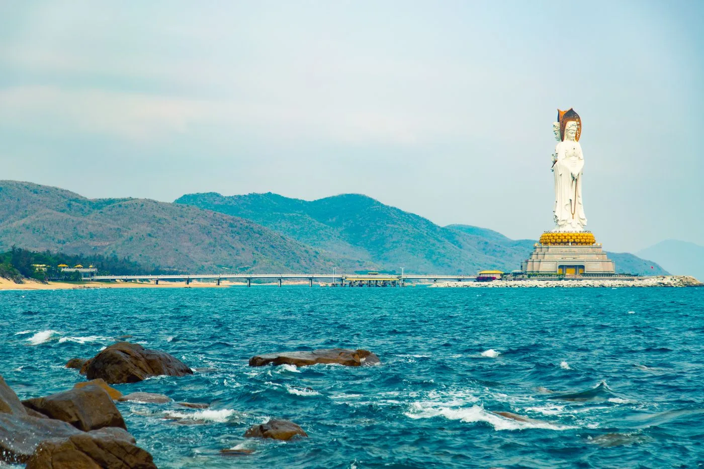 The white Guanyin of Nanshan statue standing above the sea off Sanya, Hainan