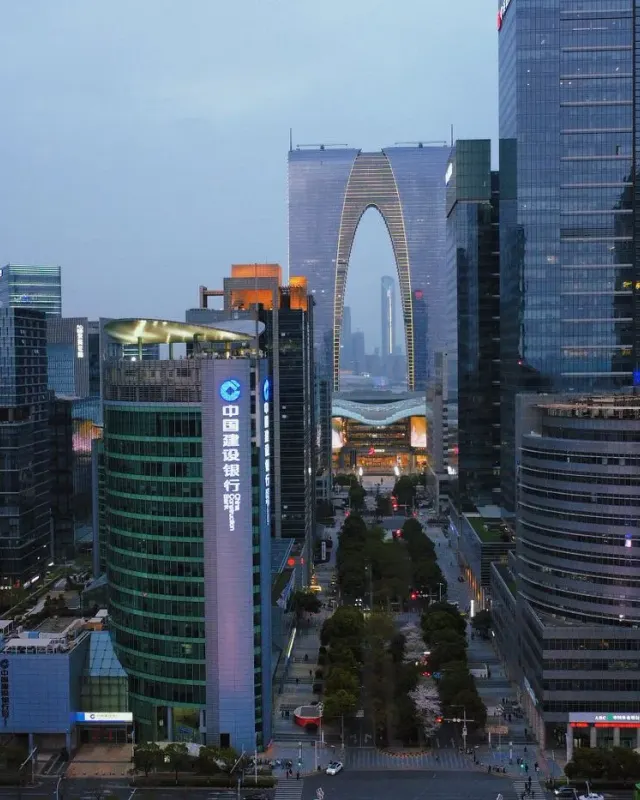 The arch-shaped Gate of the Orient rising among the modern buildings of Suzhou