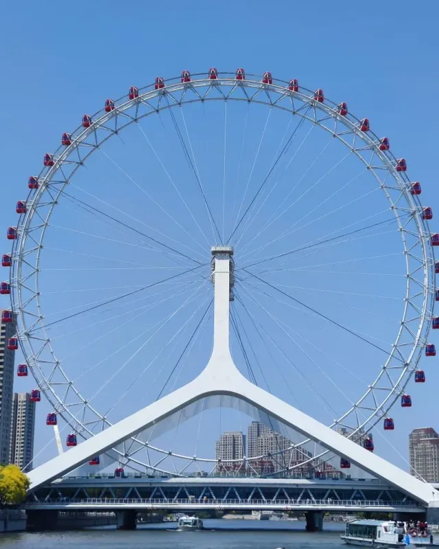 The Tianjin Eye Ferris wheel above the Yongle Bridge on the Hai River in Tianjin